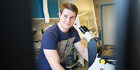 Guy by microscope